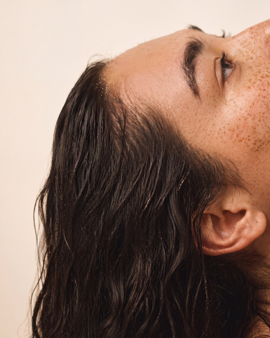 Close-up of wet hair and scalp after a sauna session.