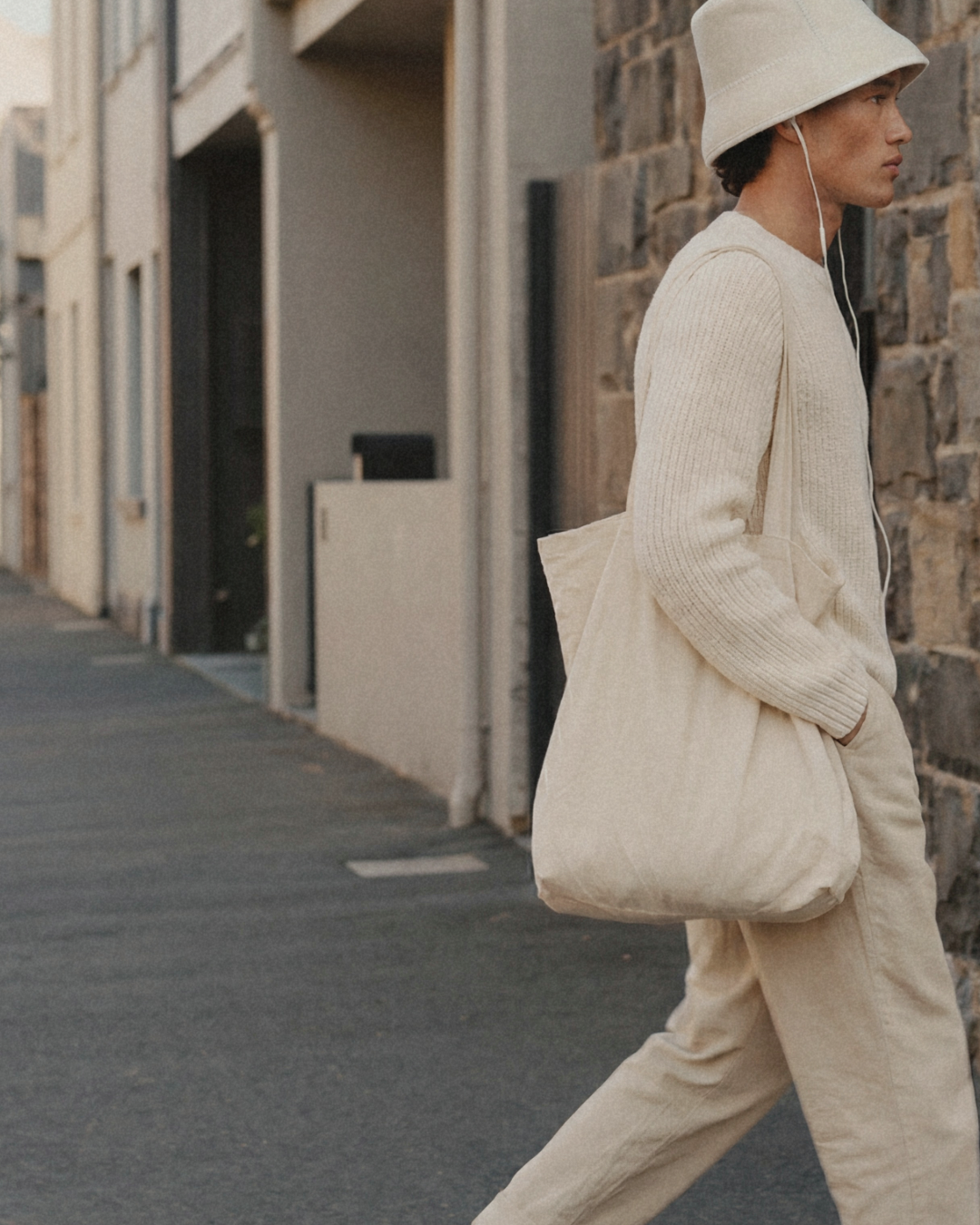 Man walking outdoors wearing Humi sauna hat in Soft Cloud with matching outfit